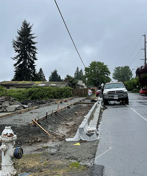 Sidewalk & curb gather concrete in Renton 